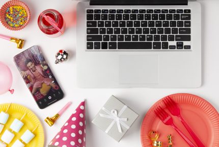 flat-lay-party-decorations-with-laptop